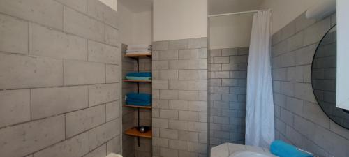 a bathroom with a shower and a toilet and a sink at Residence Riviera in Porto-Vecchio