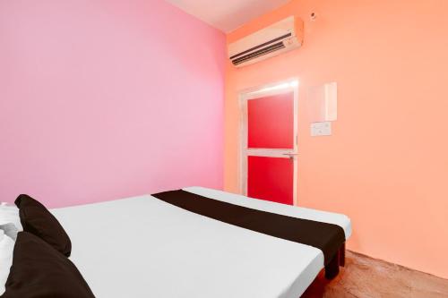 Postel nebo postele na pokoji v ubytování Hotel O SK Grand