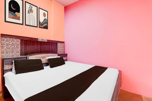 Postel nebo postele na pokoji v ubytování Hotel O SK Grand