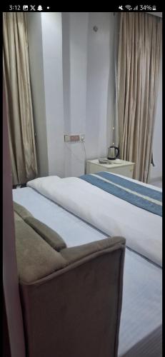 Ένα ή περισσότερα κρεβάτια σε δωμάτιο στο MAXI Villa intercontinental hotel Nsukka