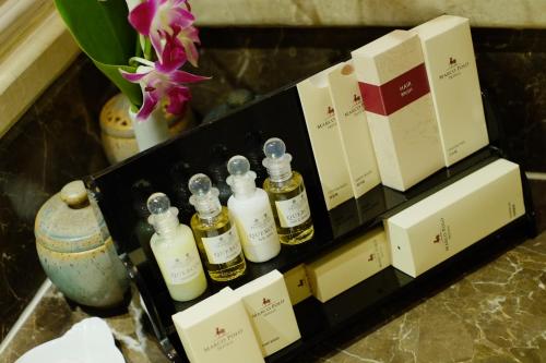 a group of bottles of essential oils on a shelf at Marco Polo Plaza Cebu in Cebu City