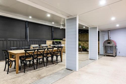 a dining room with a table and chairs at Washington Cottage in Angaston