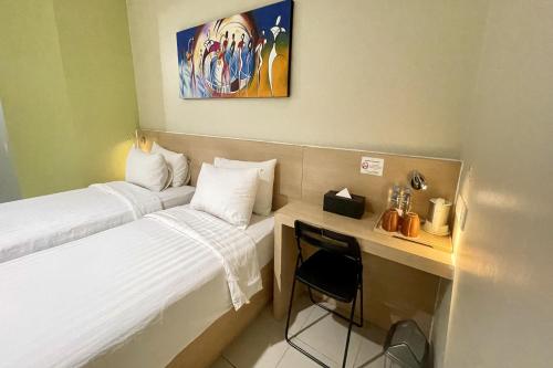 Кровать или кровати в номере Lemo Hotel Serpong