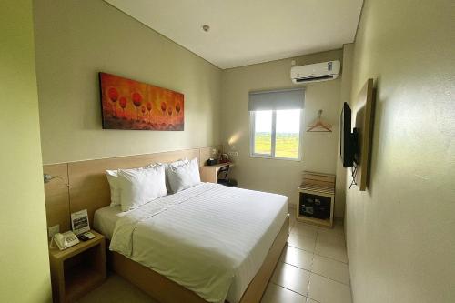 Телевизор и/или развлекательный центр в Lemo Hotel Serpong