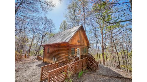 a small wooden cabin in the middle of the woods at Solitude in Bryson City