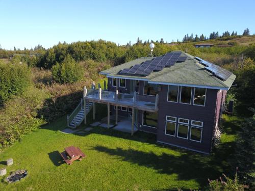 an overhead view of a house with solar panels on it at Raven Guesthouse in Homer