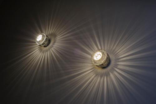 two lights are pointing in the same direction at The Hide London in Hendon