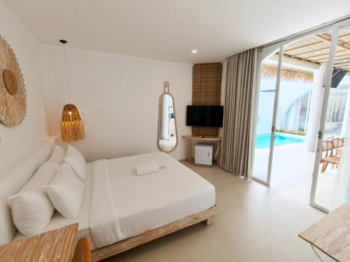 Кровать или кровати в номере Khaiyyara Jimbaran Bali