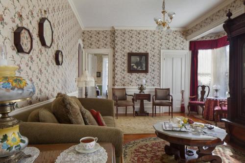 a living room with a couch and a table at Isaiah Jones Homestead Bed and Breakfast in Sandwich