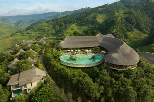 an aerial view of a resort with a swimming pool at Garrya Mù Cang Chải in Mù Cang Chải