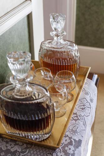a tray with glasses and a glass pot on a table at Isaiah Jones Homestead Bed and Breakfast in Sandwich