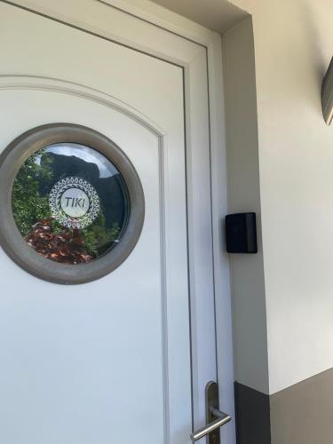 a door with a round window on it at Tiki Ora Lodge - TIKI in Bora Bora