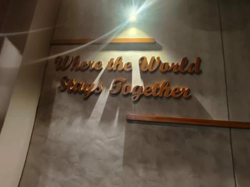 a sign that reads where the world is safer together at Zostay Urban Retreat Deluxe Rooms & Premium Dorms in Manjeri