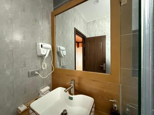 Koupelna v ubytování Cara dè NATURE Hotel and Spa By HAN
