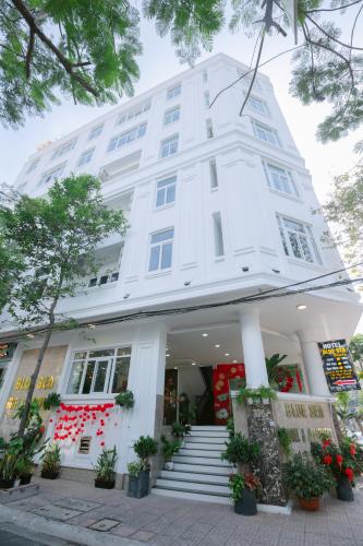 a white building with stairs in front of it at Blue Sea Luxury Hotel & Apartment Vũng Tàu in Vung Tau