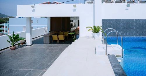 a balcony with a swimming pool on a building at Blue Sea Luxury Hotel & Apartment Vũng Tàu in Vung Tau