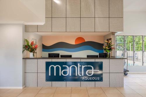 a sign for a marina appliances store in a lobby at Mantra Aqueous on Port in Port Douglas