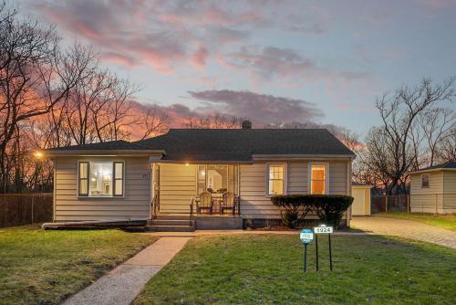 a small house with a sign in the front yard at The Young’s - Northern Indiana in Gary