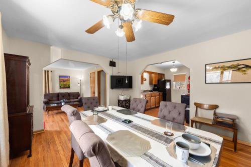 a dining room and living room with a table and chairs at The Young’s - Northern Indiana in Gary