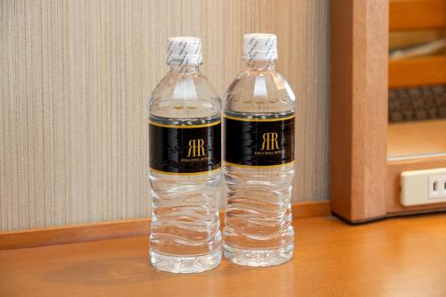 two bottles of water sitting on top of a table at Toshi Center Hotel in Tokyo