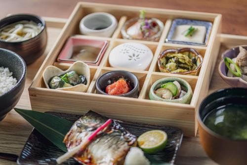 abento box filled with different types of food at The Gate Hotel Fukuoka by Hulic in Fukuoka