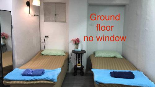 Postel nebo postele na pokoji v ubytování Baan1668 Hometel near Chinatown One Bangkok
