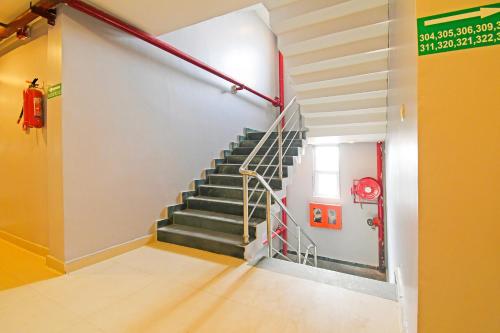 a staircase in a building with a stair case at Super Townhouse Mancheswar Industrial Estate in Bhubaneshwar