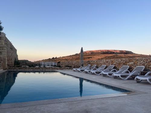 Piscina en o cerca de Veduta Ta Pinu Apartments with Stunning Views Garden Sauna Pool and Gym