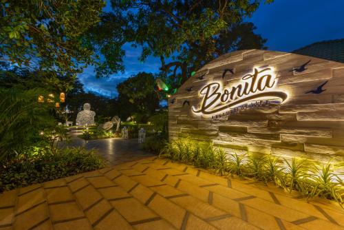 a sign for a ballina restaurant at night at Heritage Village Resort & Spa Goa in Cansaulim