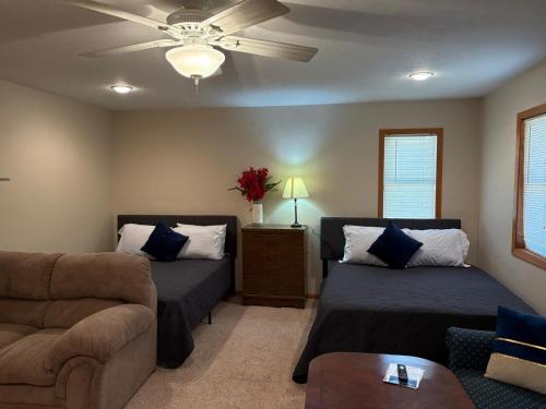 a living room with two beds and a couch at Mixon Villa-Laurel in Laurel