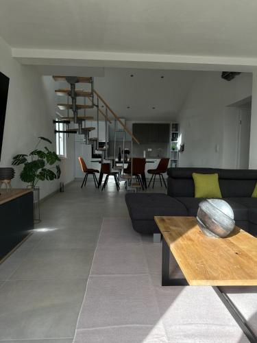 a living room with a couch and a table at Apartment Bunja No2 in Drage