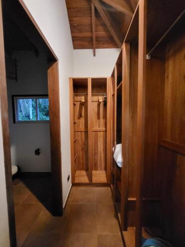 a hallway with wooden doors in a house at Platanillo Tropical Paradise in Platanillo
