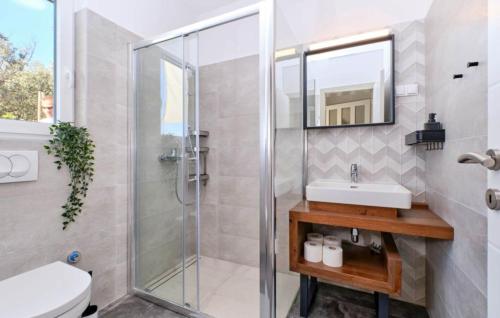 a bathroom with a glass shower and a sink at Villa Miholascica 2 in Island Cres by Villas Guide in Cres