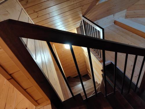 an overhead view of a wooden staircase in a house at Dzika Dziura z jacuzzi in Zawoja