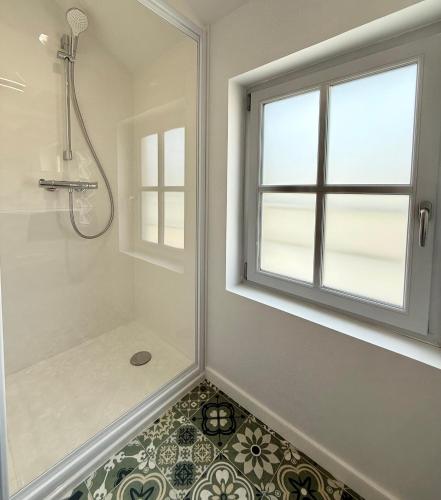 a bathroom with a shower and a window at Jolie m'Home, Le Puy du Fou, 15 pers, 7 ch, 5 sde, 5 wc in Mauléon