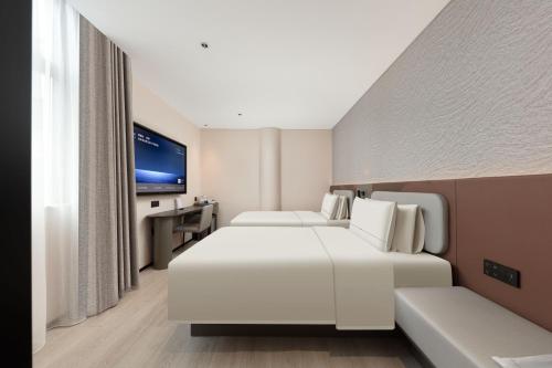 TV a/nebo společenská místnost v ubytování Atour Light Hotel Kunming Tongde Square Baiyun Road