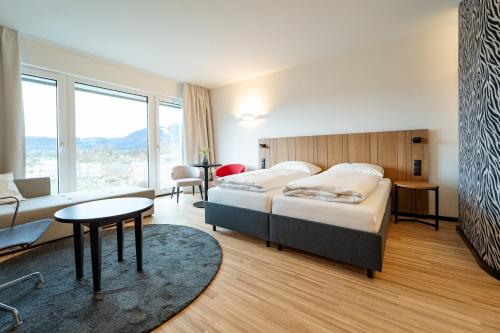 Postel nebo postele na pokoji v ubytování Amadeo Hotel Schaffenrath