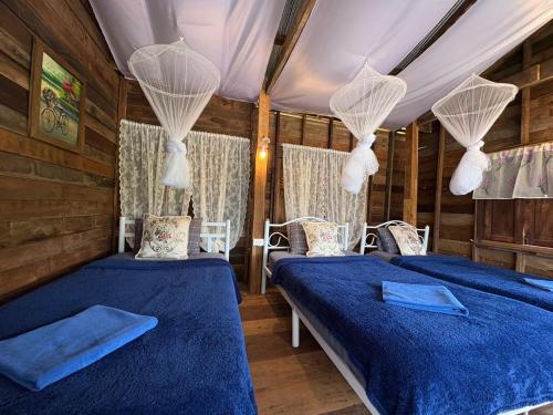 Postel nebo postele na pokoji v ubytování สะปันซีวิว ที่พักบ้านสะปัน บ่อเกลือ น่าน
