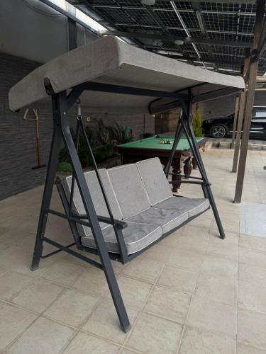 a bunk bed in a room with a pool table at Natalie water park chalet in Al Kafrayn