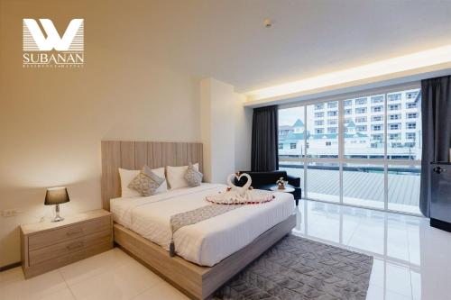 Ένα ή περισσότερα κρεβάτια σε δωμάτιο στο SUBANAN Residence Hatyai - ทรัพย์อนันต์ เรสซิเด้นซ์ หาดใหญ่