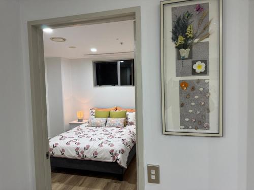 Ένα ή περισσότερα κρεβάτια σε δωμάτιο στο Penthouse Delight 3 bd 2 bth free carpark, pool & tennis court