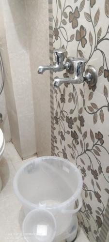 a bathroom with a toilet and a sink at The Ashish Luxury Stay in Chittaurgarh