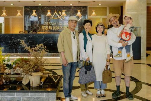 a group of people posing for a picture in a mall at Arsma Hotel in Hualien City