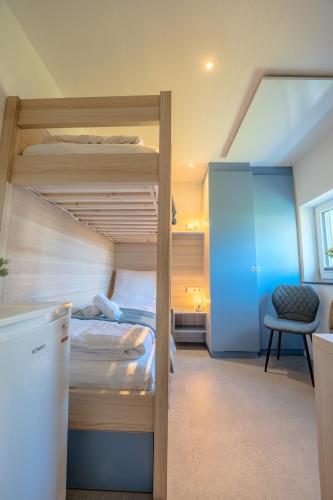 Ένα ή περισσότερα κρεβάτια σε δωμάτιο στο SCHLOSSBERG RESIDENCES - Bodensee Studio-Apartments Friedrichshafen & Ravensburger Spieleland