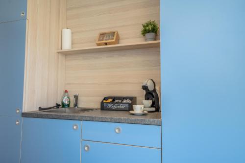 Η κουζίνα ή μικρή κουζίνα στο SCHLOSSBERG RESIDENCES - Bodensee Studio-Apartments Friedrichshafen & Ravensburger Spieleland