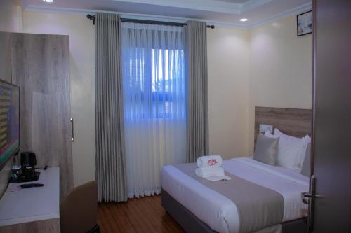 Postel nebo postele na pokoji v ubytování Amanda Resort