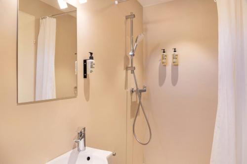 a bathroom with a shower and a sink at Chalet Sonneck - Seefeld in Seefeld in Tirol