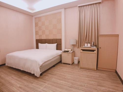 Ένα ή περισσότερα κρεβάτια σε δωμάτιο στο AOIKE Hot Spring Hotel