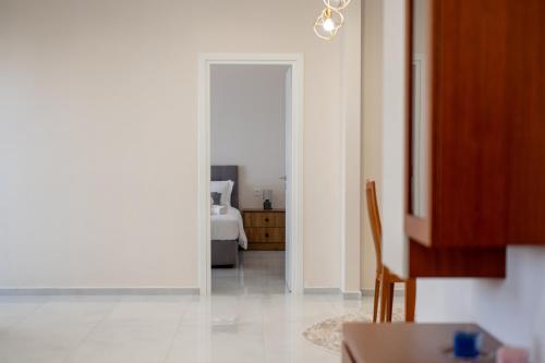 a room with a door leading to a bedroom at Natalia's Nest in Ampavris