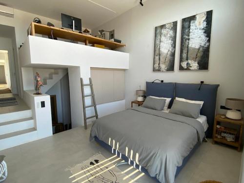 Ένα ή περισσότερα κρεβάτια σε δωμάτιο στο Clepsydra Residence